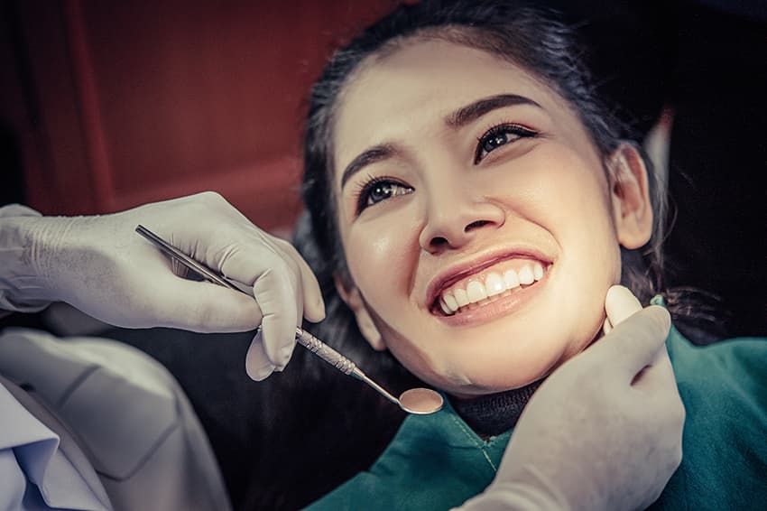 Patient smiling after professional cosmetic dentistry treatment in Nashik.